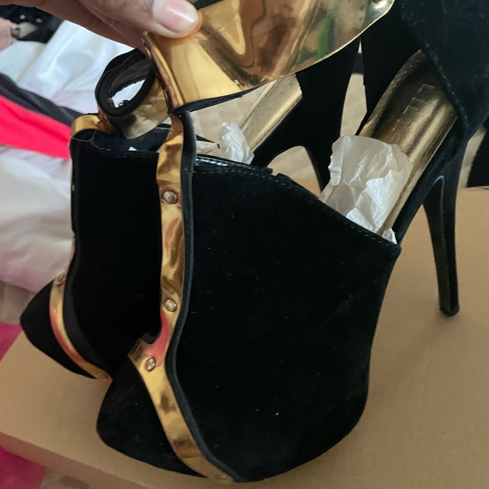 Gold and black stilettos